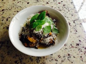 Roasted Eggplant topped with parmesan, cracked pepper and fresh basil